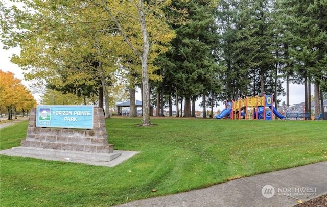 exterior space featuring a yard and a playground