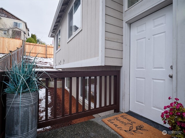 doorway to property with fence