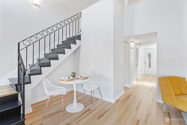 stairway featuring wood-type flooring