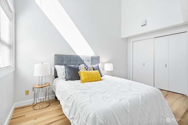 bedroom featuring hardwood / wood-style floors and a closet