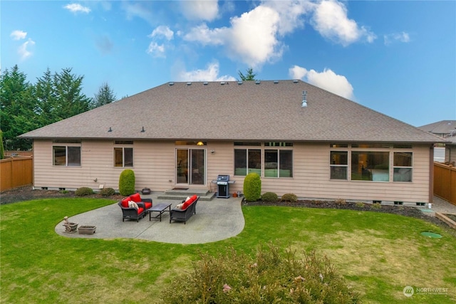 rear view of house with a lawn and a patio