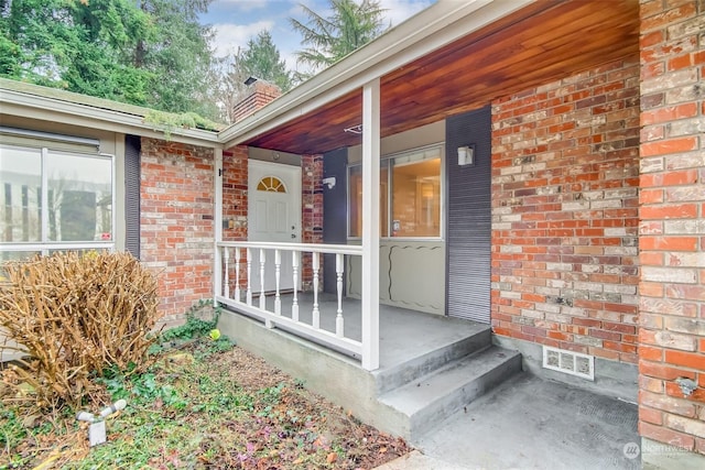 property entrance featuring covered porch