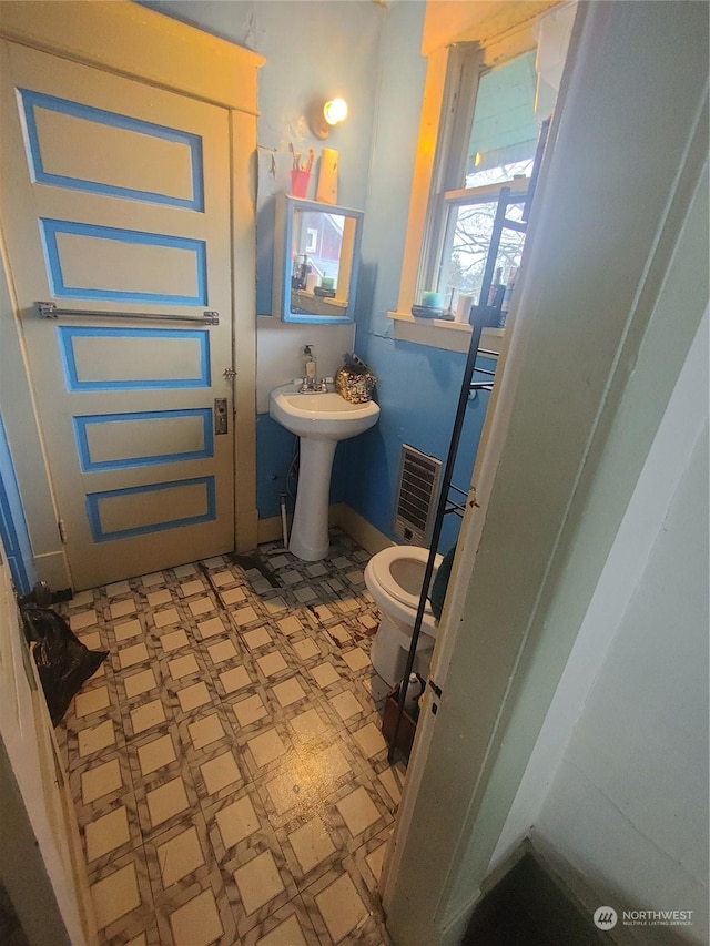 bathroom featuring toilet