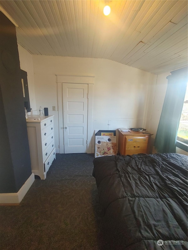 carpeted bedroom with wooden ceiling