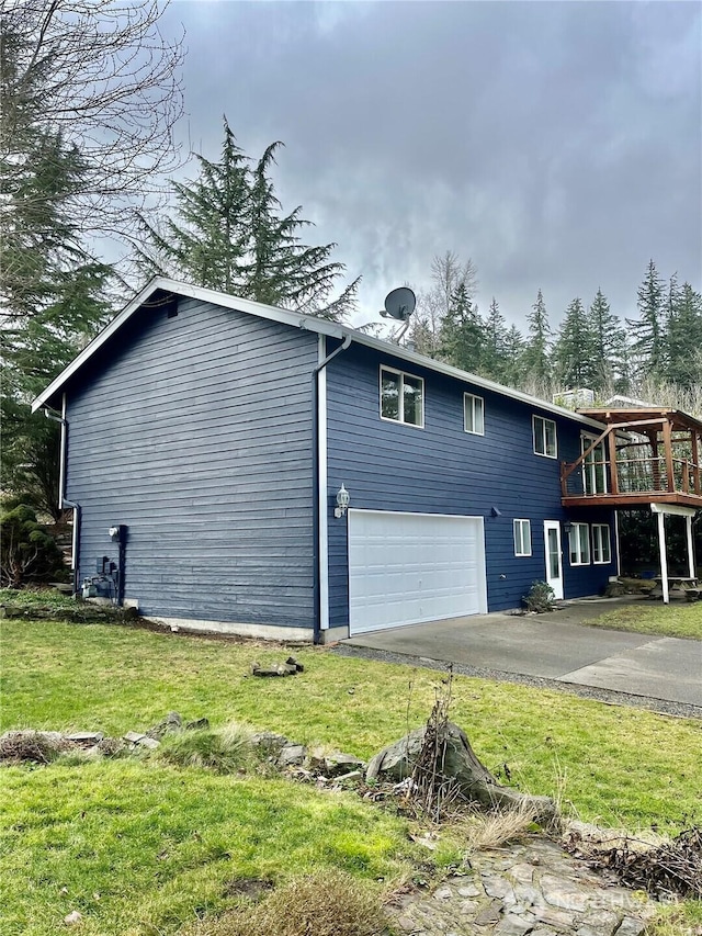 view of property exterior with driveway, a lawn, an attached garage, and a wooden deck