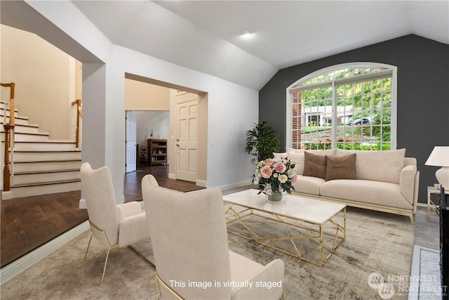 living room with hardwood / wood-style flooring and lofted ceiling