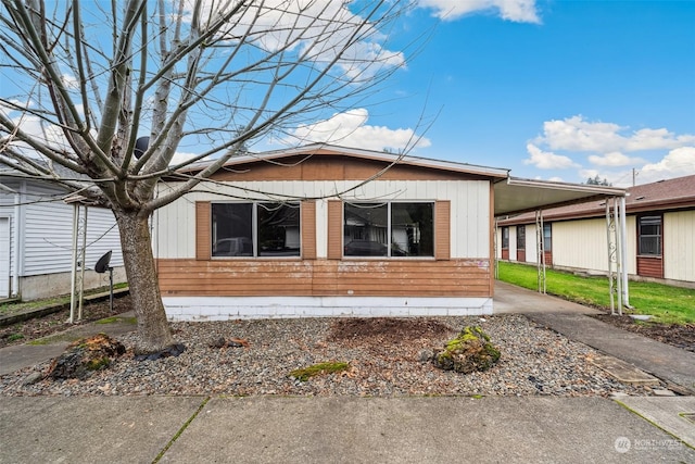 view of home's exterior with a carport