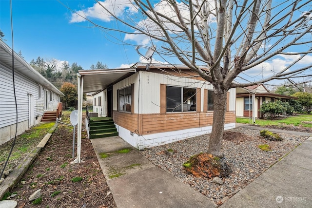 view of side of property with covered porch