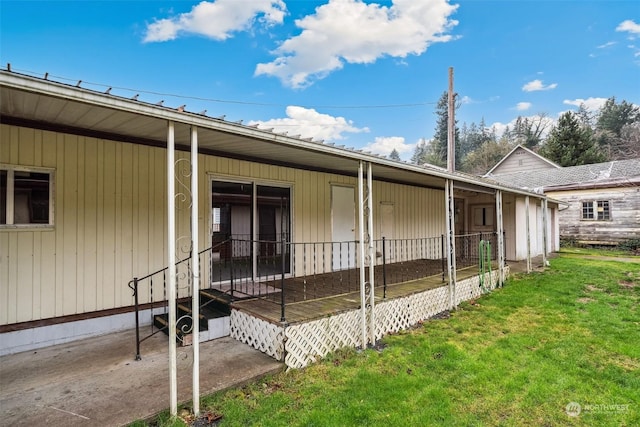 view of side of home with a lawn