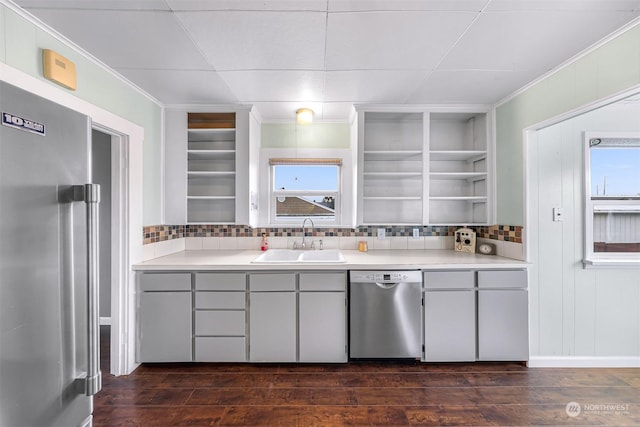 kitchen featuring plenty of natural light, stainless steel appliances, dark hardwood / wood-style floors, and sink