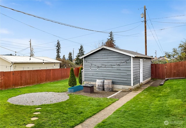 view of outdoor structure with a lawn