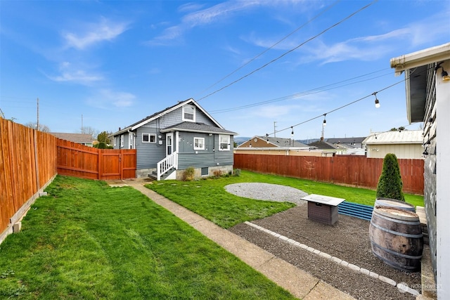 rear view of property featuring a lawn