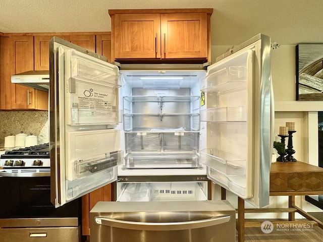 kitchen with decorative backsplash and refrigerator