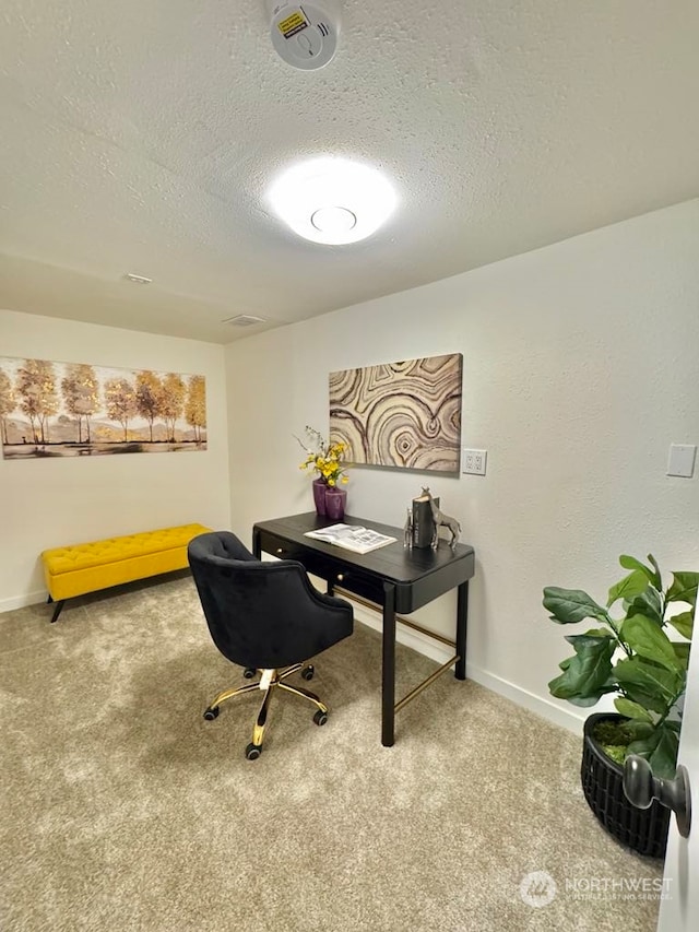 office featuring carpet and a textured ceiling