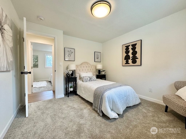 bedroom featuring light carpet