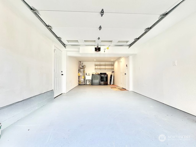 garage with sink, washer and clothes dryer, water heater, and a garage door opener