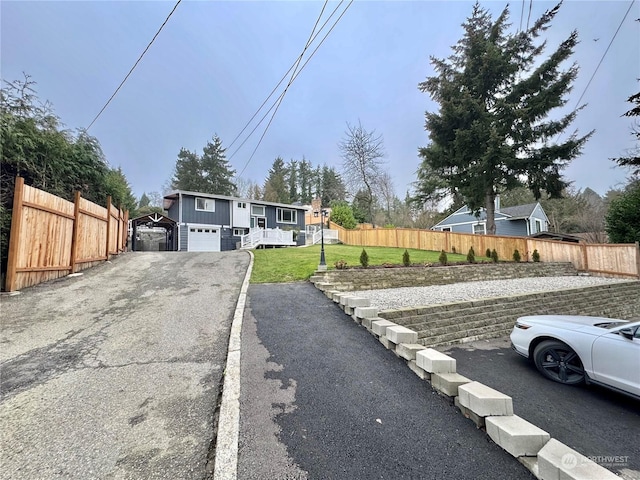 view of front of house with a front yard and a garage