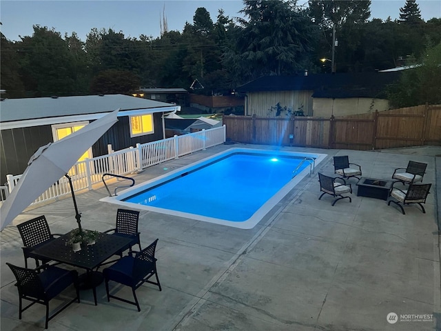 view of swimming pool with a patio