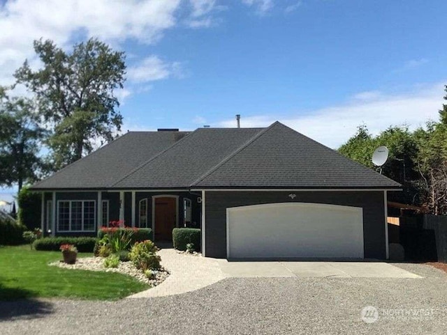 ranch-style house featuring a garage