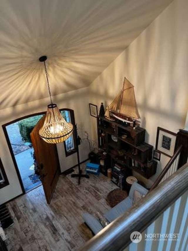 interior space with hardwood / wood-style flooring and a notable chandelier