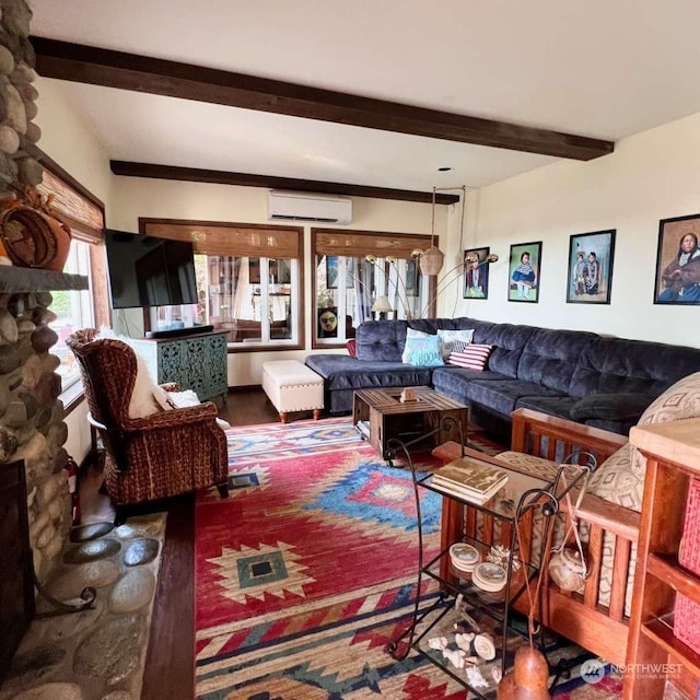 living room with a fireplace, beamed ceiling, and a wall mounted air conditioner