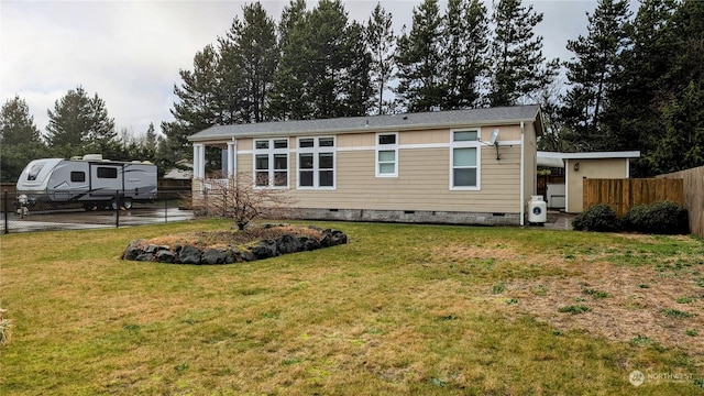 rear view of house with a lawn