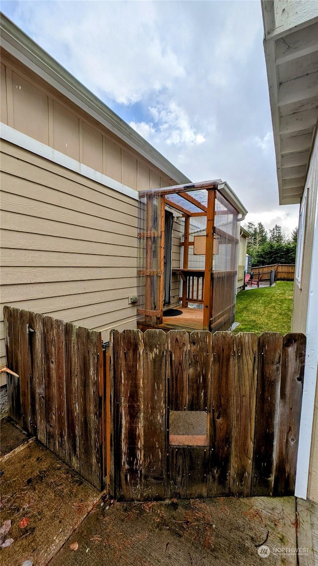 view of property exterior with an outbuilding