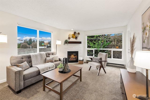 carpeted living room with plenty of natural light and a textured ceiling