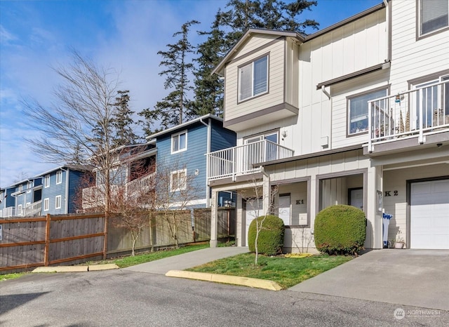 view of front of property with a balcony and a garage