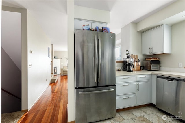 kitchen featuring appliances with stainless steel finishes and white cabinetry