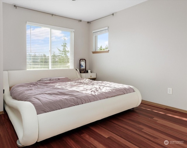 bedroom featuring dark hardwood / wood-style floors