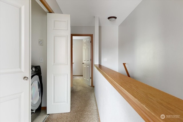 washroom with washer / clothes dryer and light carpet