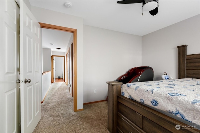 bedroom featuring ceiling fan, a closet, and light carpet