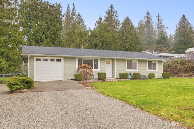 single story home with a front lawn and a garage