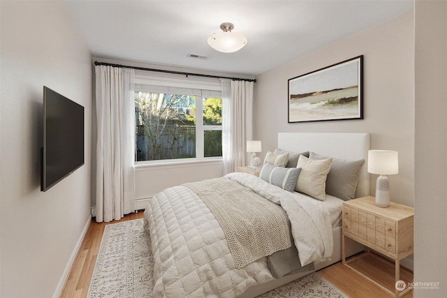 bedroom with light wood-type flooring