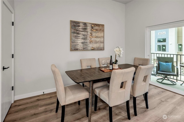 dining area with wood-type flooring