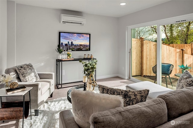 living room with a wall mounted AC and light colored carpet