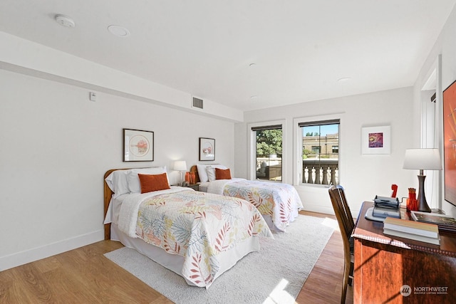 bedroom with light hardwood / wood-style flooring