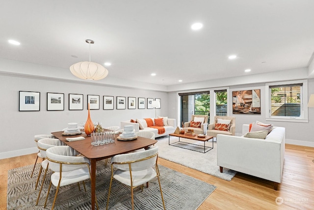 dining space with light hardwood / wood-style flooring