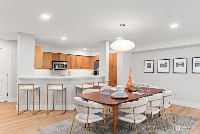 dining room featuring light wood-type flooring