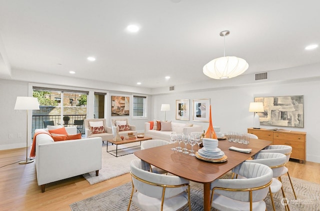 dining area featuring light wood-type flooring