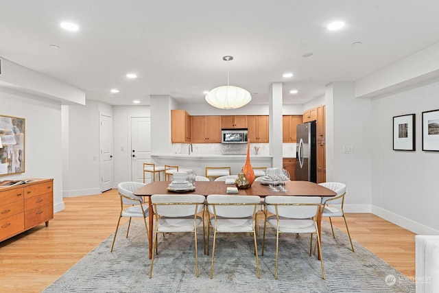 dining room featuring light wood-type flooring