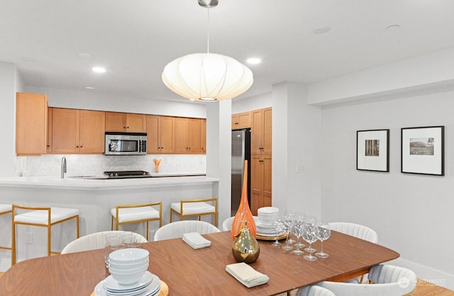 dining space with sink