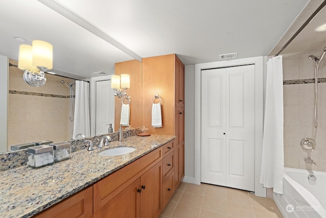 bathroom featuring tile patterned flooring, vanity, and shower / bathtub combination with curtain