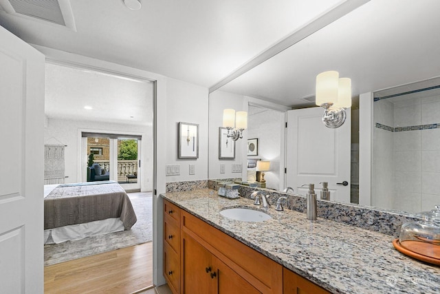 bathroom featuring vanity and hardwood / wood-style floors