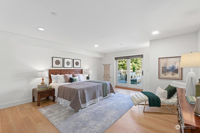 bedroom with light hardwood / wood-style flooring and access to outside