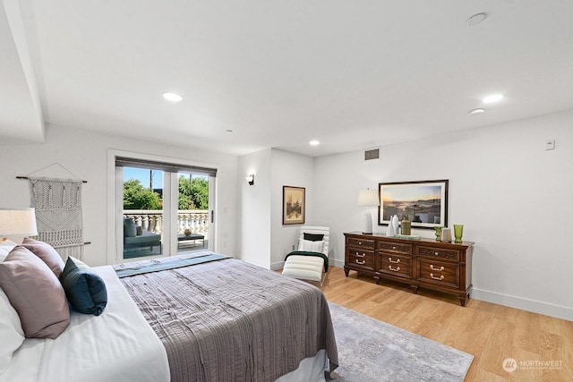 bedroom with light hardwood / wood-style flooring and access to outside