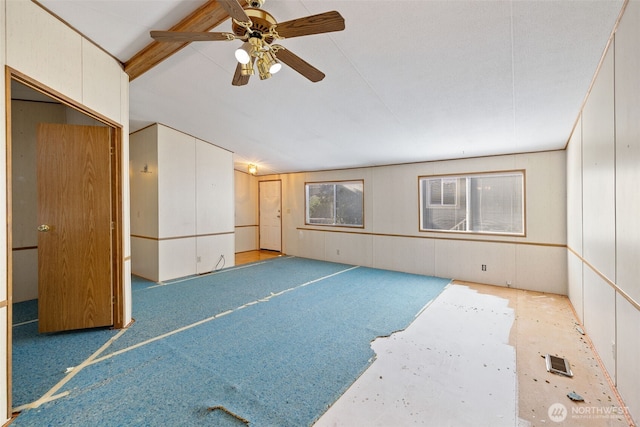 spare room with light colored carpet and ceiling fan