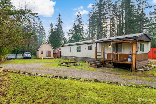 view of front of home featuring an outbuilding