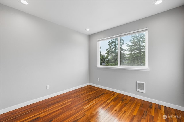 empty room featuring hardwood / wood-style floors